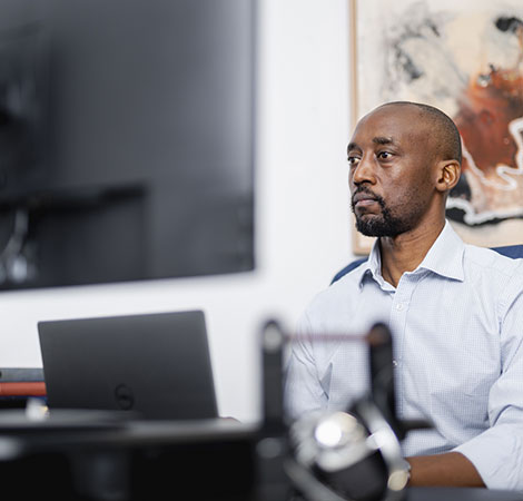 Moses Matema working on a geological database